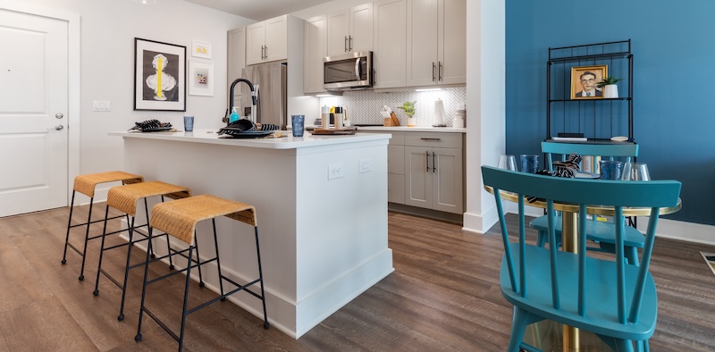 kitchen with ample counter-space, modern appliances and bright lighting
