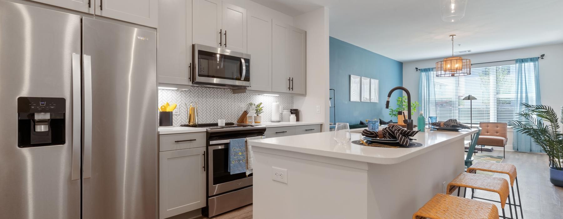 a kitchen with white cabinets
