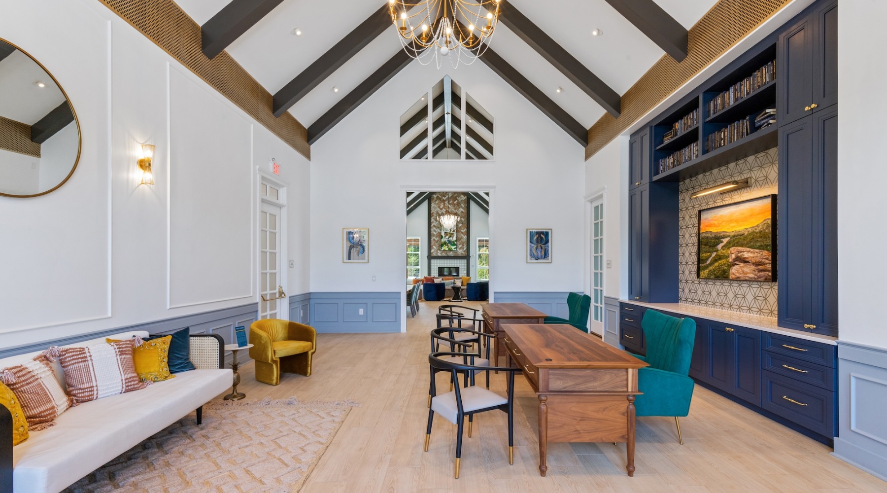 a lounge with a TV and spacious seating areas