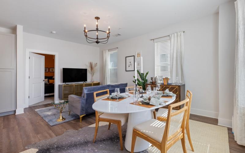 a dining room with a couch and a table