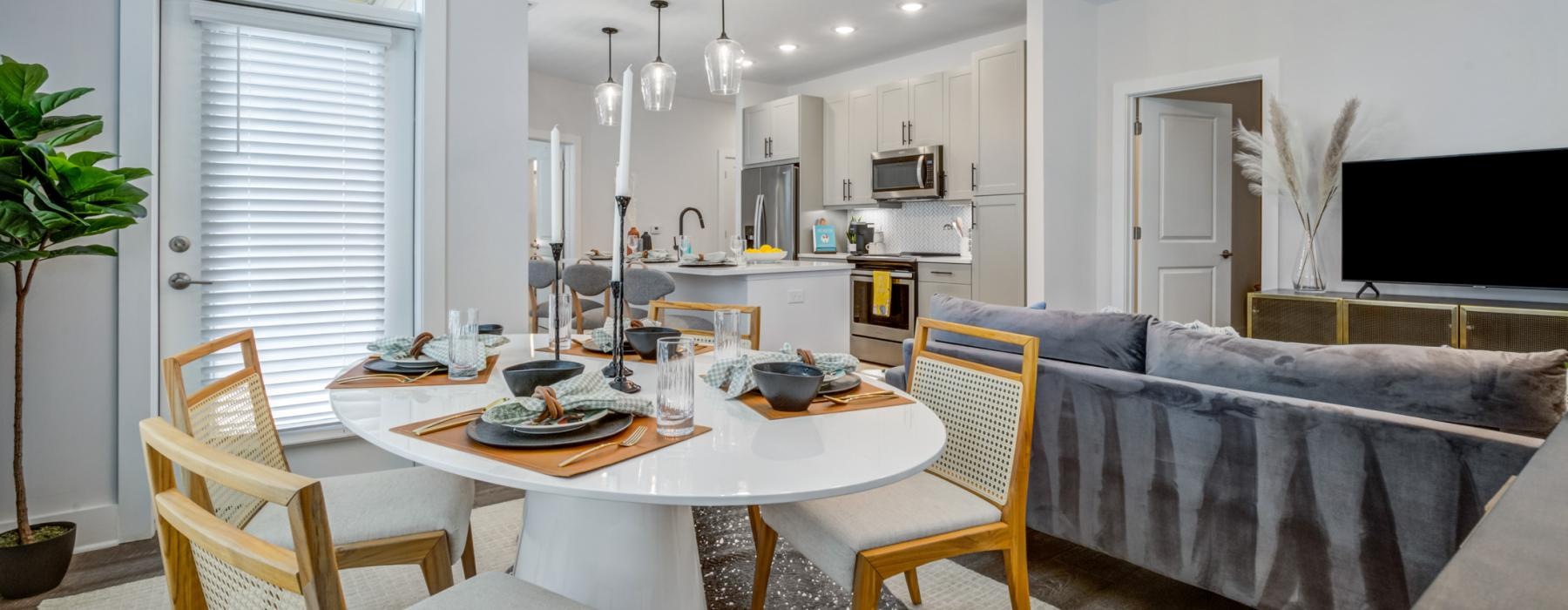 a dining room with a couch and a table