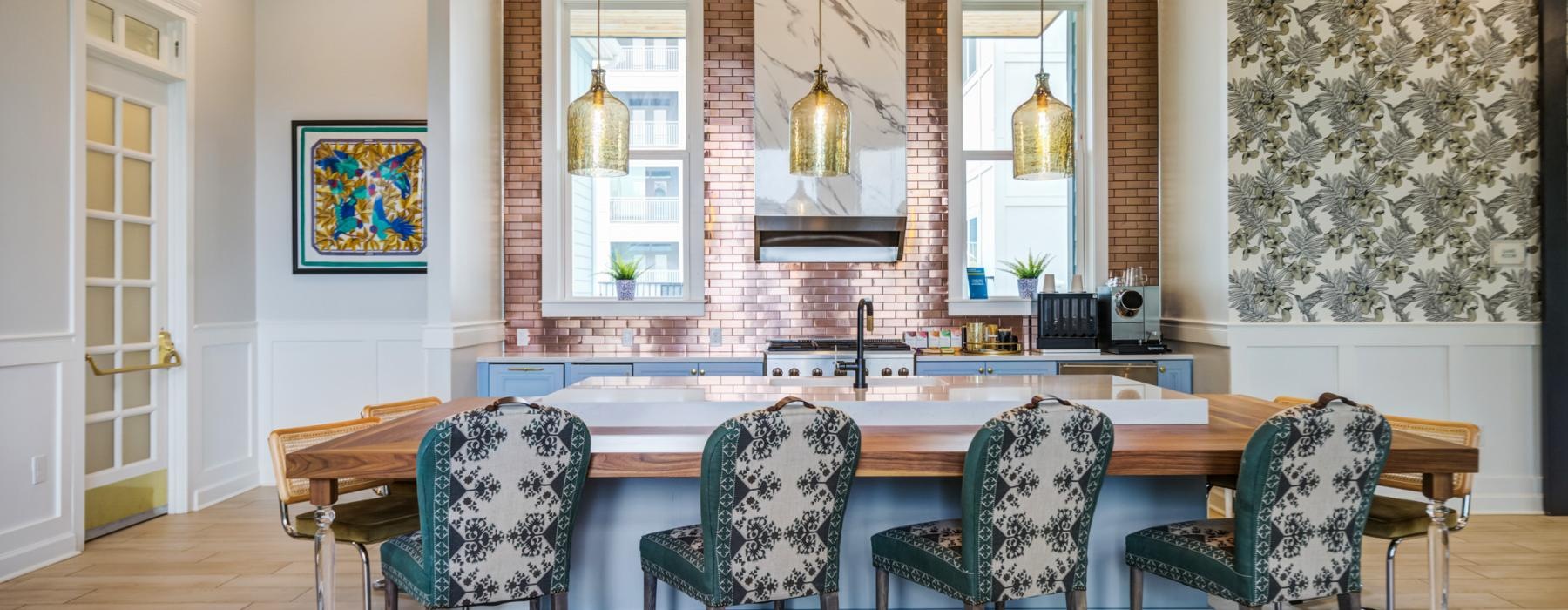 a kitchen with a bar and chairs