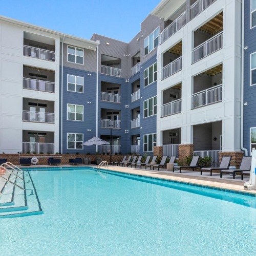 a swimming pool in front of a building
