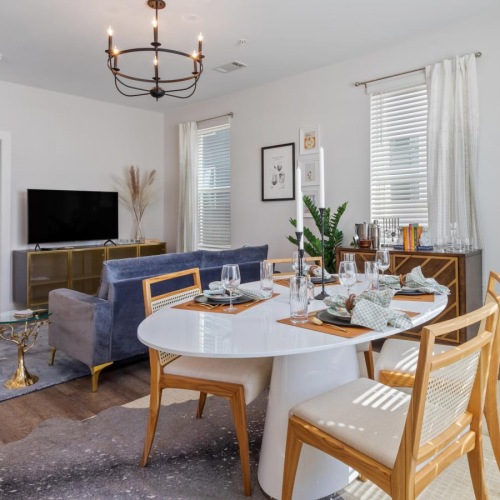 a dining room with a couch and a table