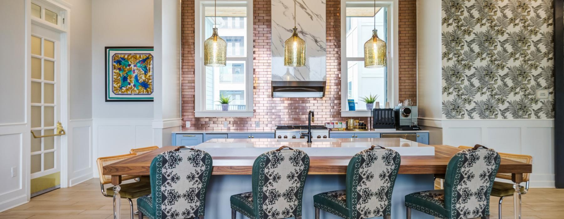 a kitchen with a bar and chairs